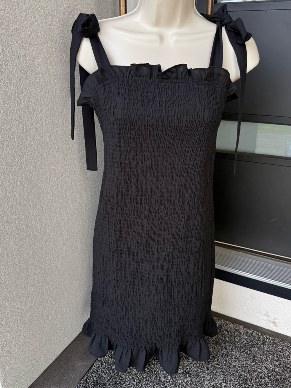 Black smocked tie strap dress. large junior